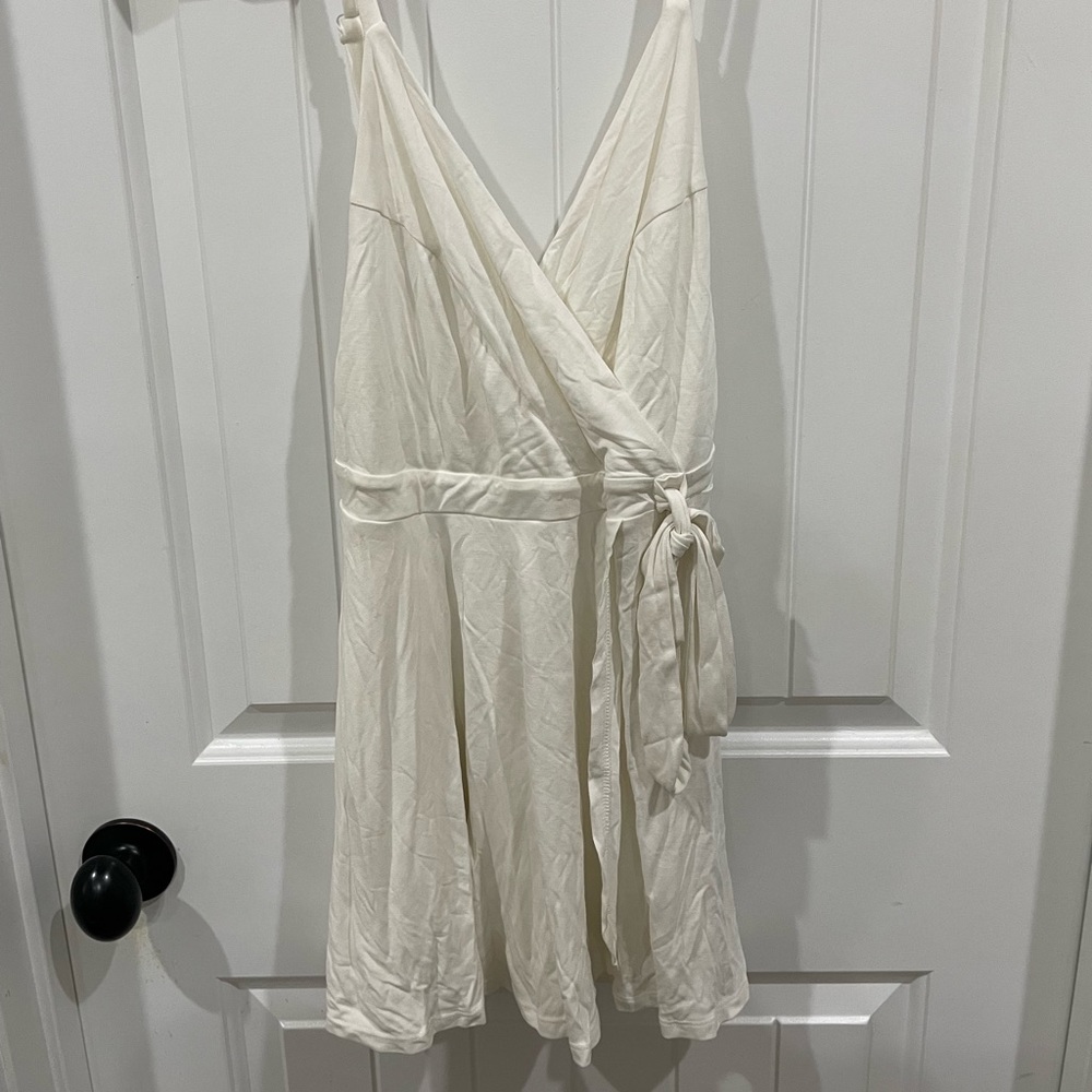 Urban Outfitters  white Wrap Romper women’s size medium flowy spaghetti straps